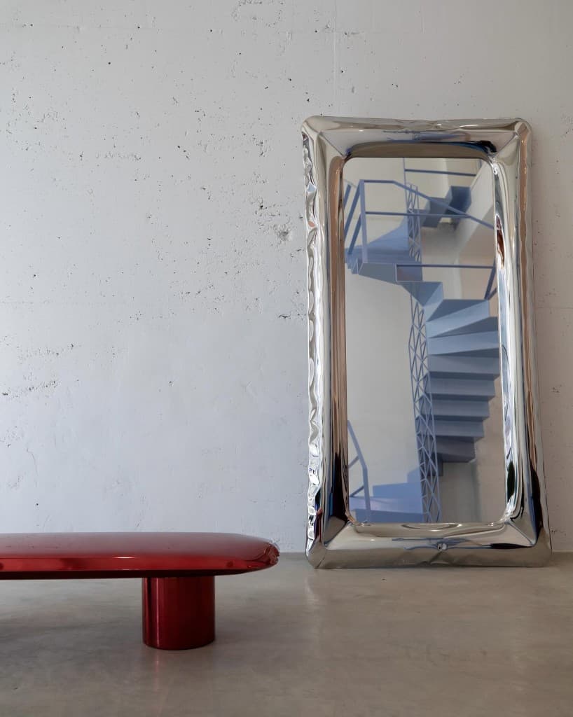 Chrome mirror and red lacquer bench